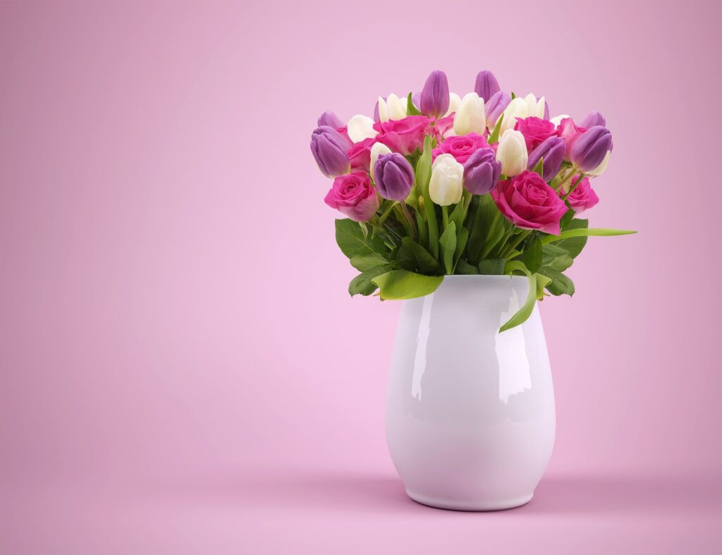 Pastel tulips in a ceramic vase