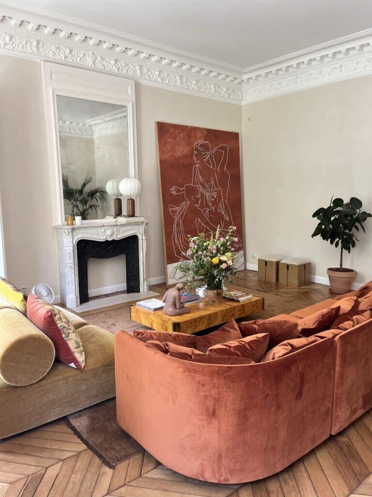 A living room showcasing a large art against the wall